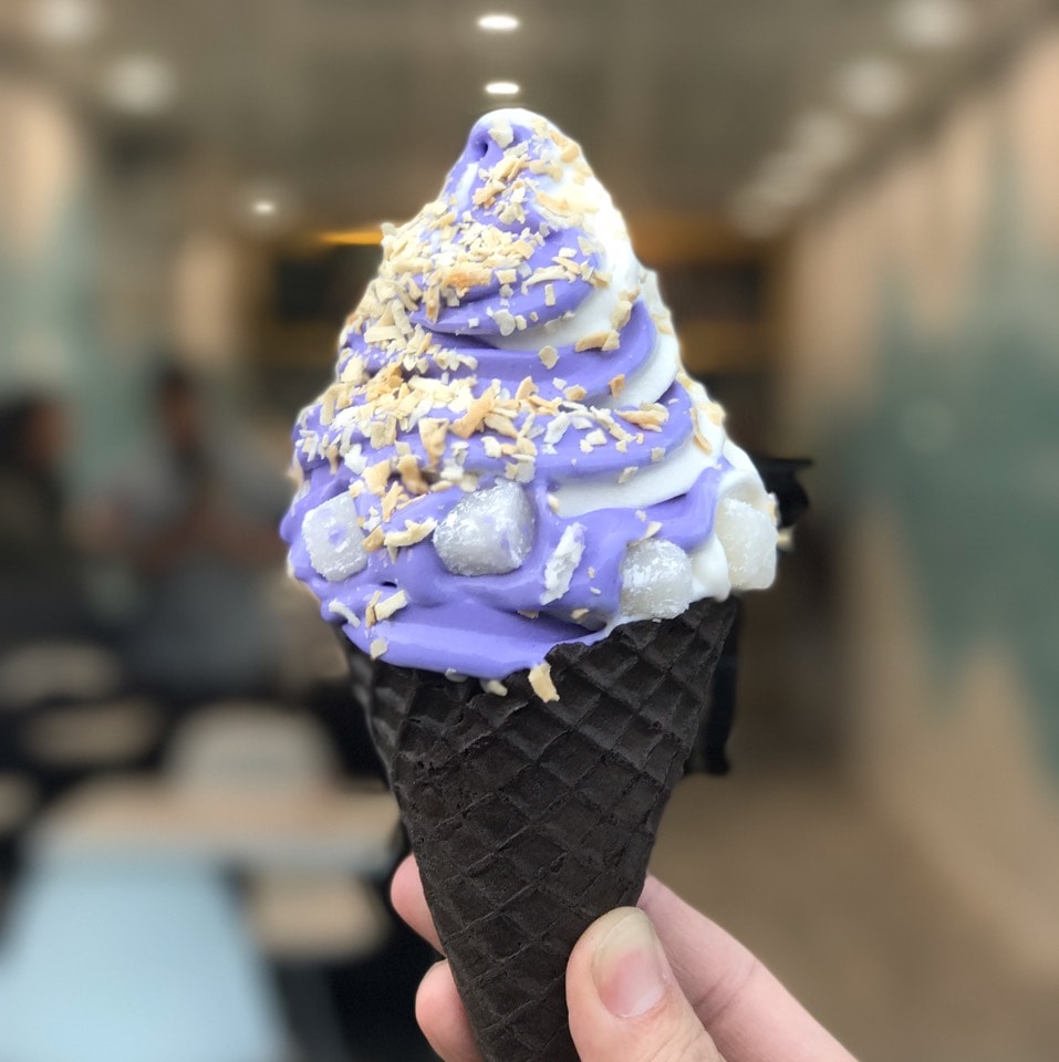 Ube vanilla swirl soft serve cone close-up