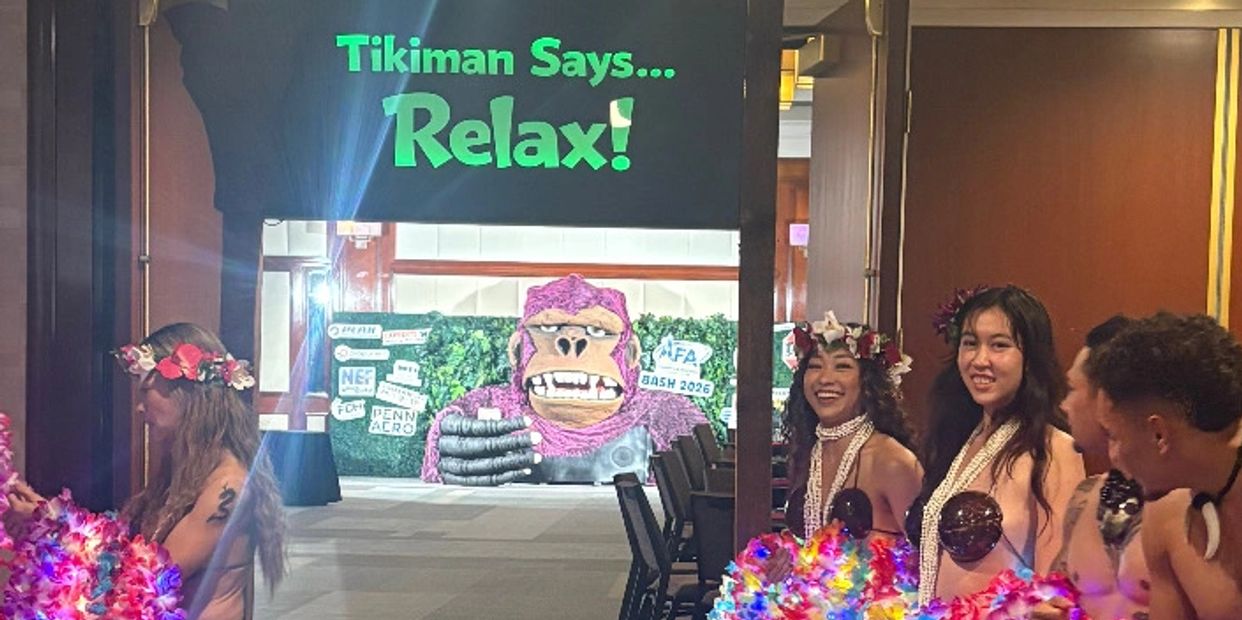 Polynesian performers in colorful costumes at hotel event